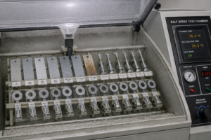 Salt spray test chamber with samples mounted inside